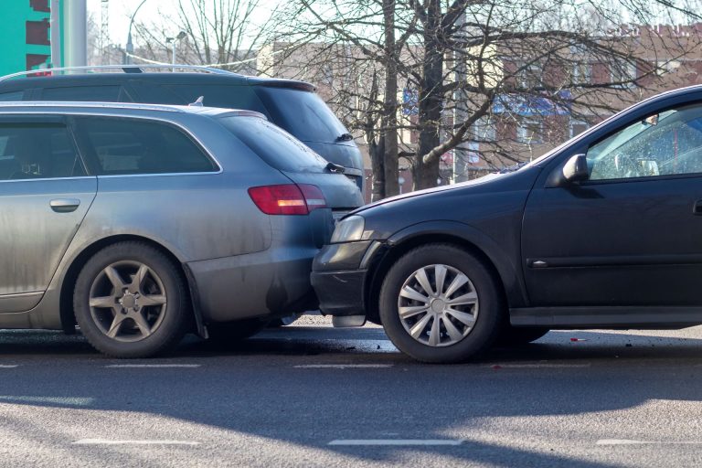 A car crashing into the back of another in a rear end collision